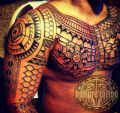 maori tattoo on chest and arm