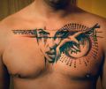 face and bird tattoo on chest