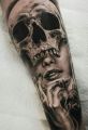 girl face skull tattoo on hand