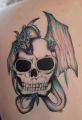 dragon on skull design tattoo